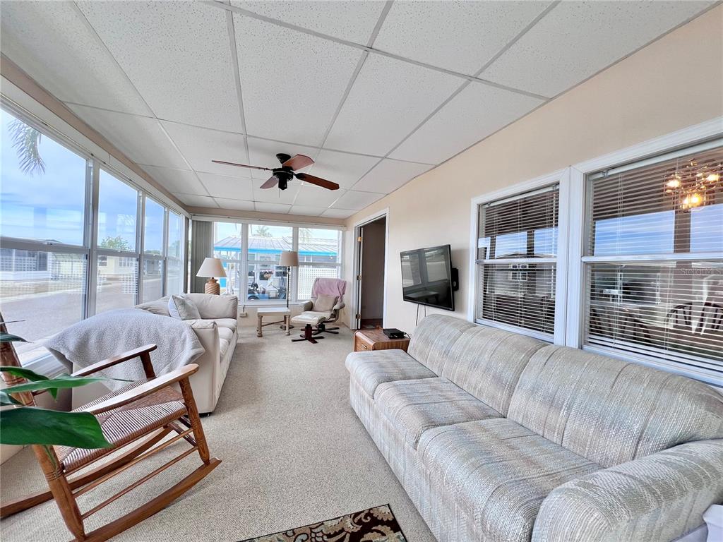 1100 South Belcher Road, Unit 663 Largo, FL 33771 - Photo 6 of 65 a living room with furniture and a large window