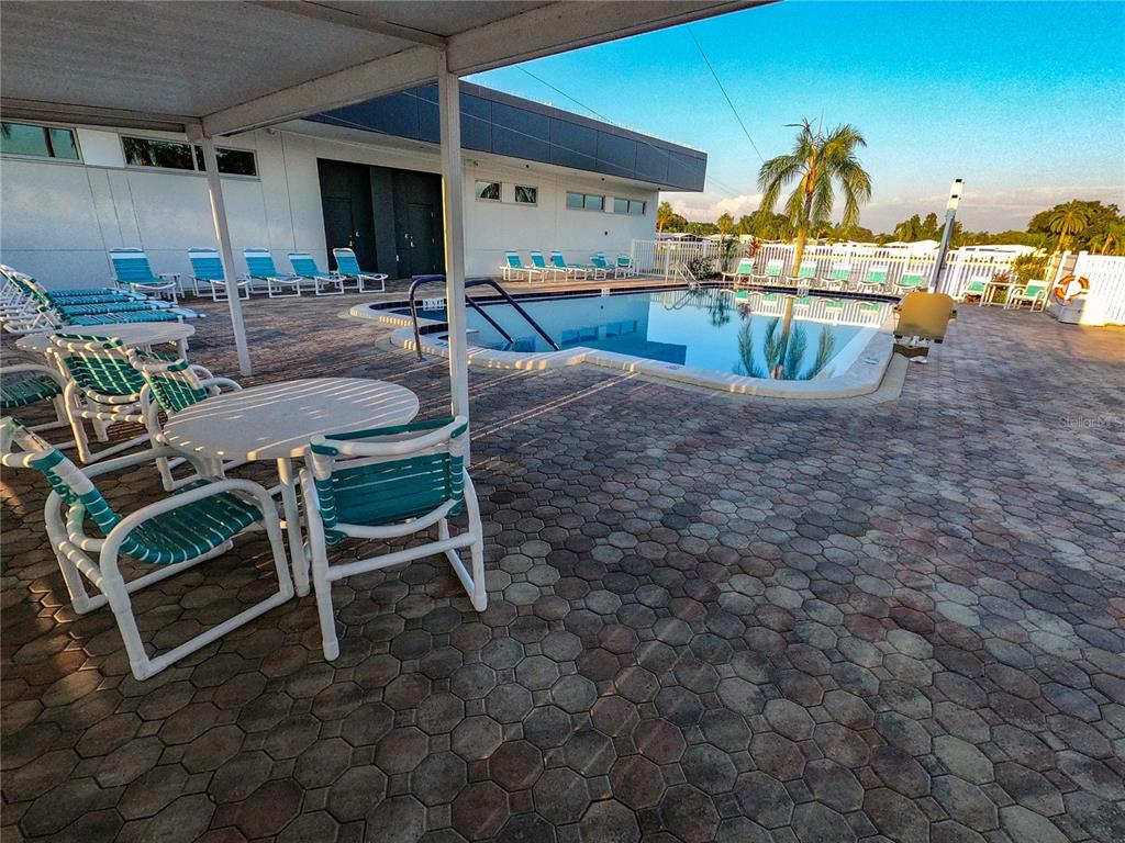 1100 South Belcher Road, Unit 663 Largo, FL 33771 - Photo 62 of 65 a view of a patio with a table and chairs