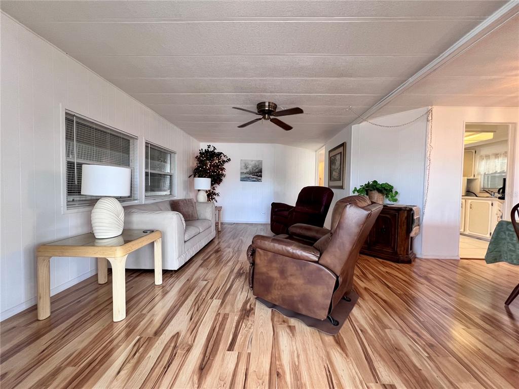 1100 South Belcher Road, Unit 663 Largo, FL 33771 - Photo 8 of 65 a living room with furniture and a wooden floor