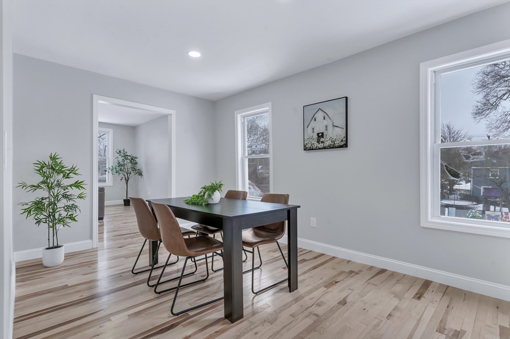 73 Walnut Street Dedham, MA 02026 - Photo 11 of 35 a view of a dining room with furniture and wooden floor