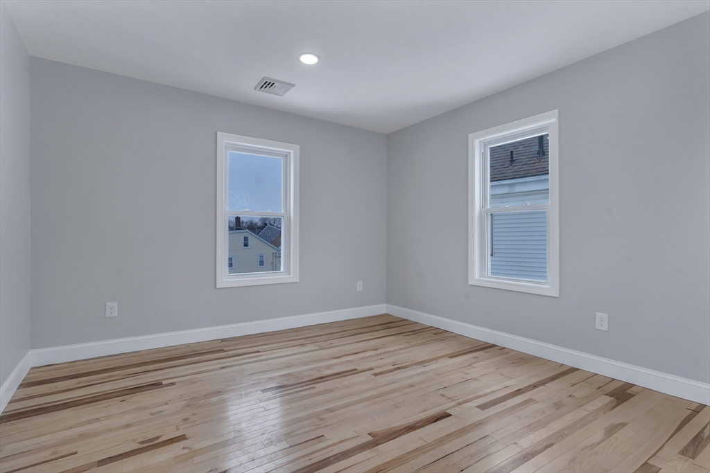 73 Walnut Street Dedham, MA 02026 - Photo 22 of 35 a view of a room that has wooden floor and window in it