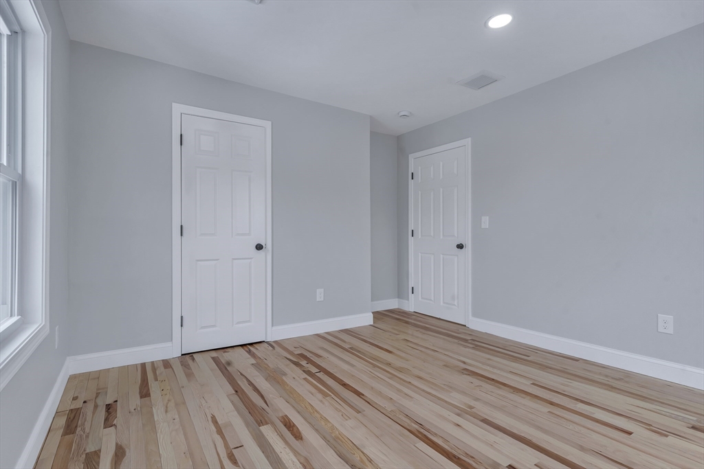 73 Walnut Street Dedham, MA 02026 - Photo 24 of 35 a view of room with wooden floor