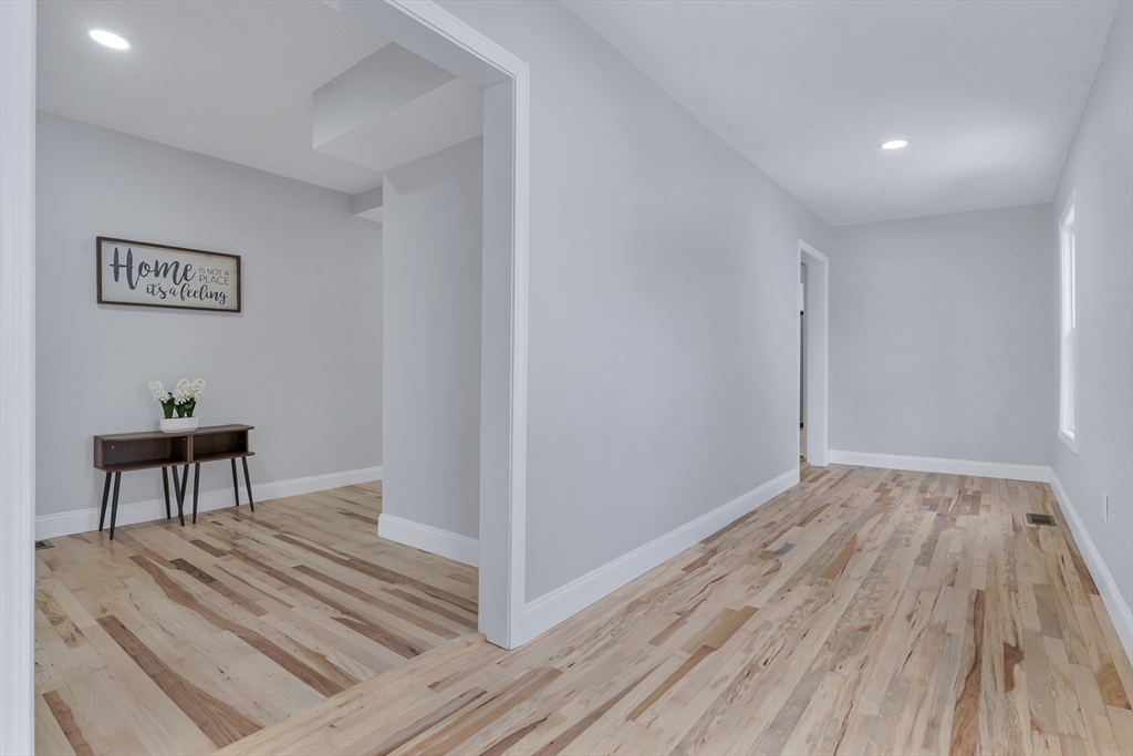 73 Walnut Street Dedham, MA 02026 - Photo 26 of 35 a view of a room with wooden floor and table
