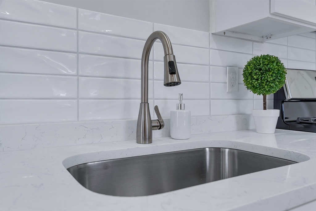 73 Walnut Street Dedham, MA 02026 - Photo 5 of 35 a view of a sink and faucet