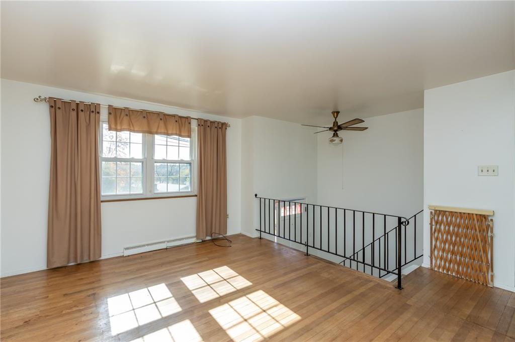 419 Manor Road Delmont, PA 15626 - Photo 14 of 30 wooden floor in an empty room with a window