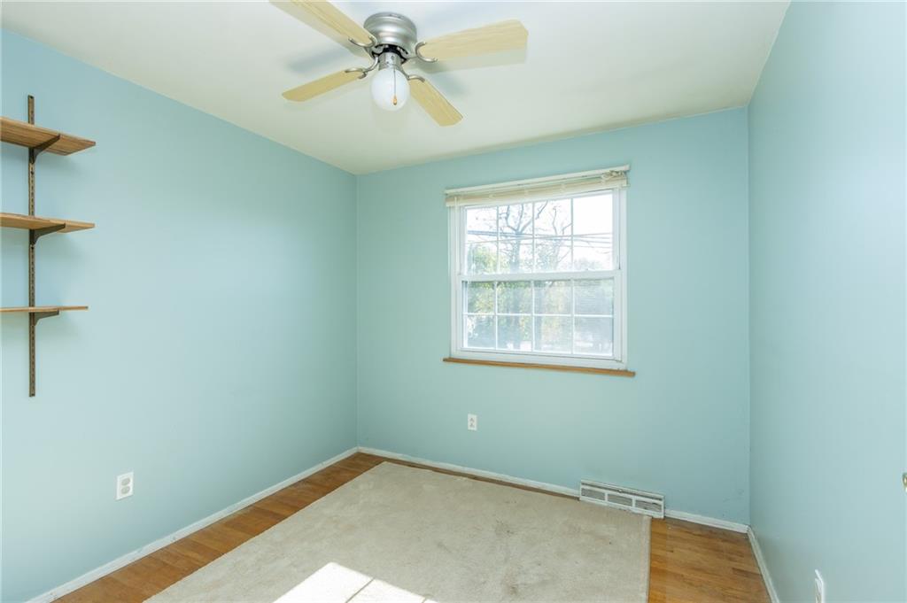 419 Manor Road Delmont, PA 15626 - Photo 27 of 30 an empty room with windows and fan