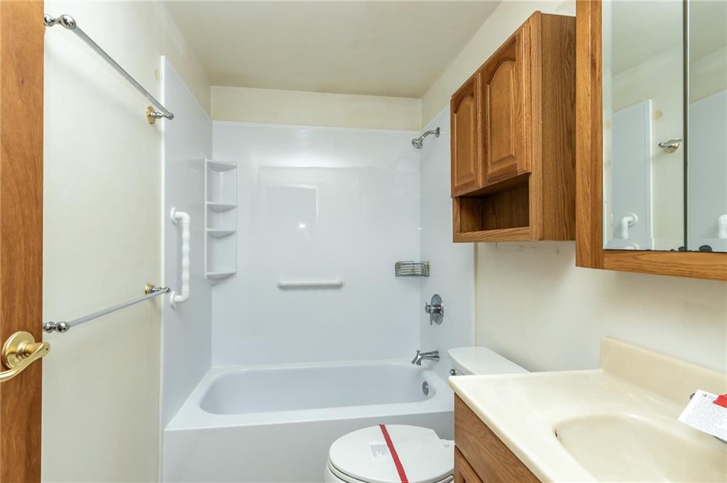 419 Manor Road Delmont, PA 15626 - Photo 30 of 30 a bathroom with a sink a toilet and bathtub