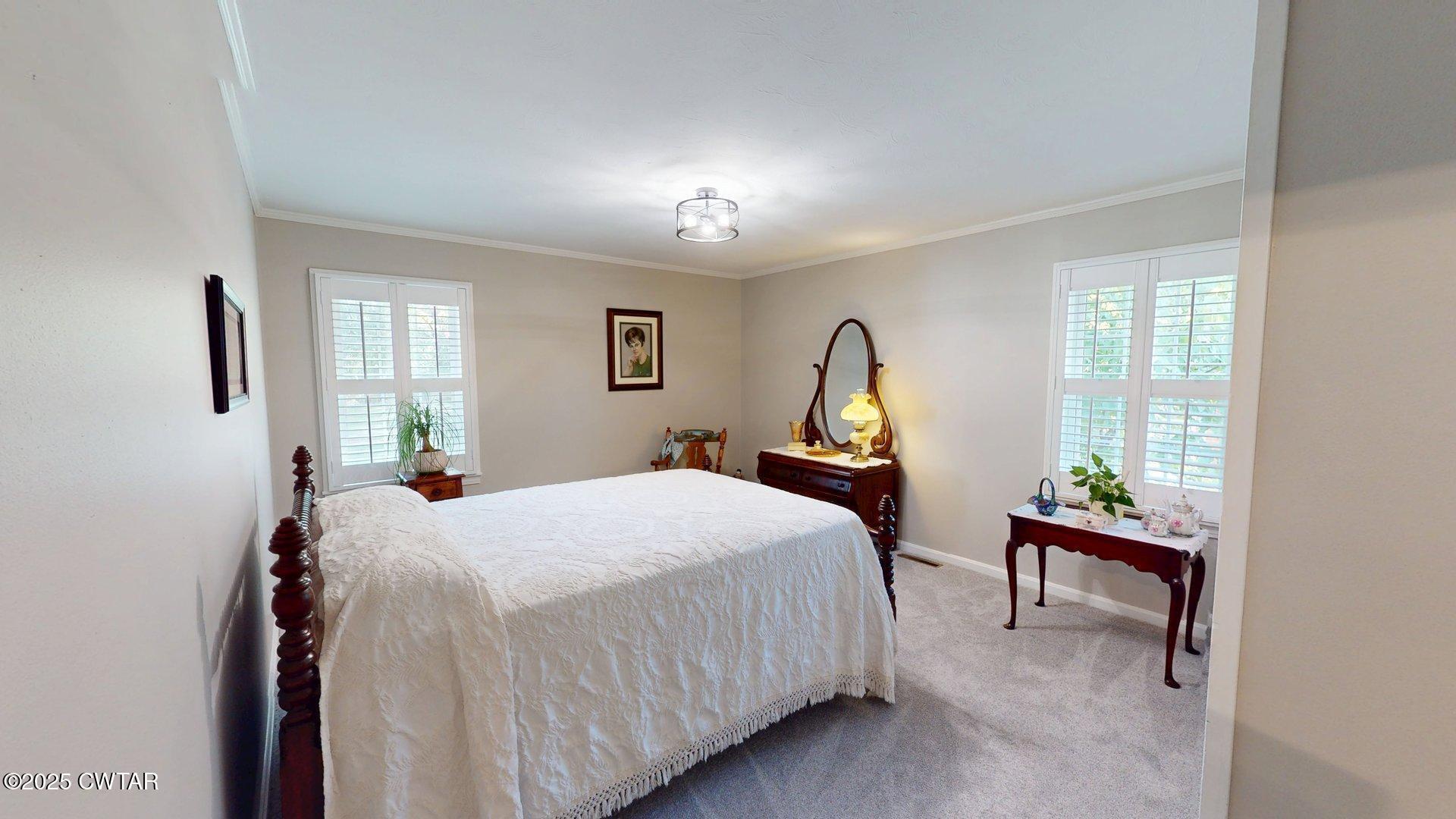302 Flora Circle Newbern, TN 38059 - Photo 12 of 26 a bedroom with a bed and a window