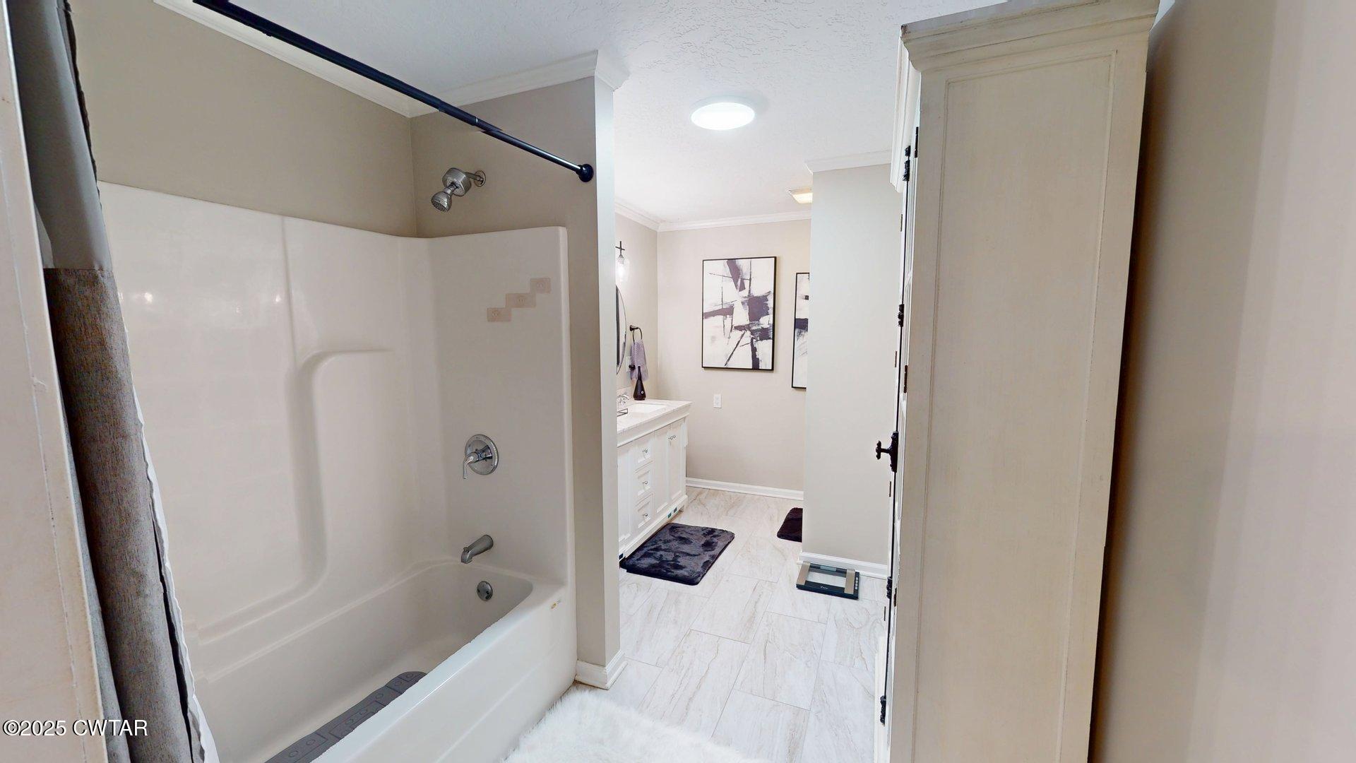 302 Flora Circle Newbern, TN 38059 - Photo 21 of 26 a bathroom with a bathtub and a shower