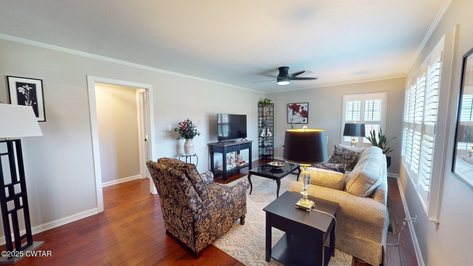 302 Flora Circle Newbern, TN 38059 - Photo 3 of 26 a living room with furniture and a wooden floor