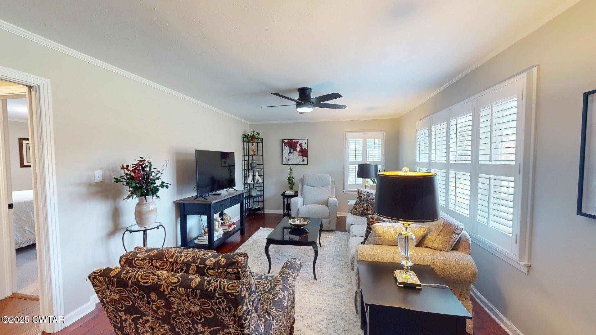 302 Flora Circle Newbern, TN 38059 - Photo 4 of 26 a living room with furniture and a flat screen tv