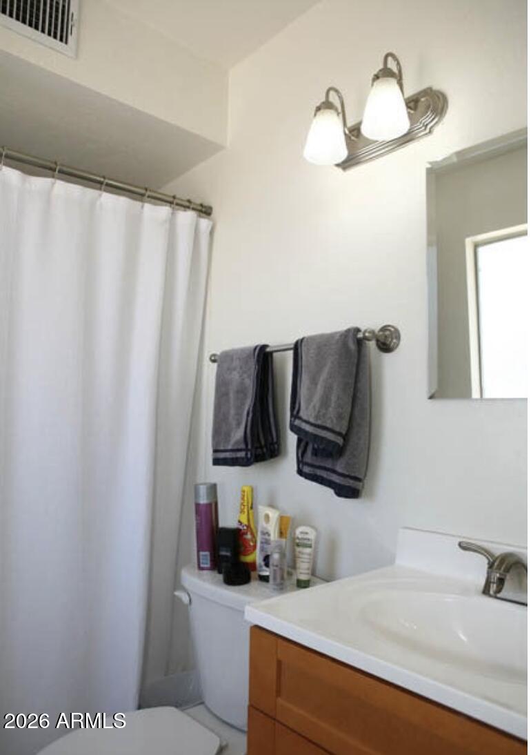 911 West Colgate Drive Tempe, AZ 85283 - Photo 11 of 15 a bathroom with a sink and a mirror