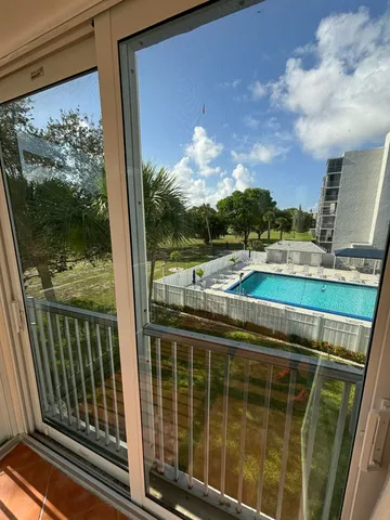 a view of a balcony with city view
