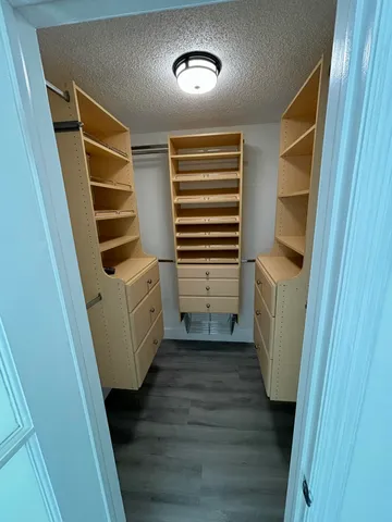 a view of a room with stairs and wooden floor