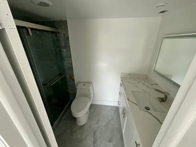a bathroom with a sink and toilet