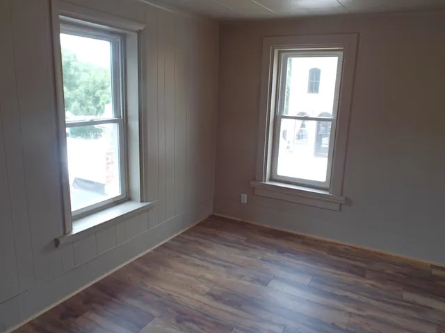 a close view of walk in closet with empty racks