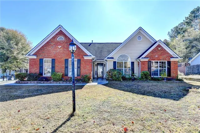 a front view of a house with yard