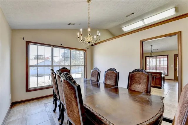 a kitchen with stainless steel appliances granite countertop a stove and a microwave