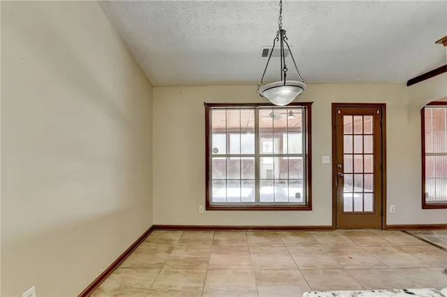a view of a kitchen with a sink wooden floor and a window