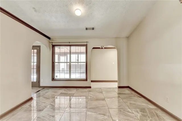 a view of an empty room and window