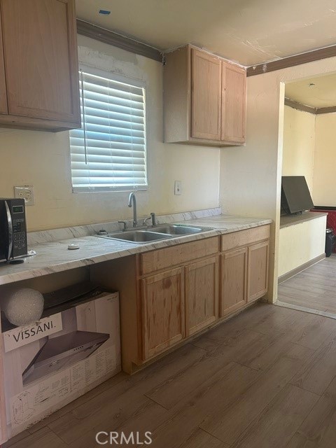 35057 Birch Road Barstow, CA 92311 - Photo 2 of 15 a kitchen with a sink cabinets and window