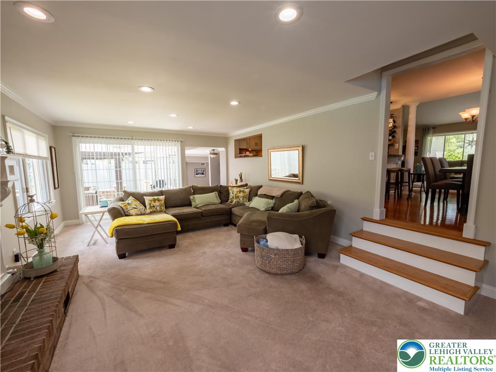 2087 Hopewell Road Bethlehem, PA 18017 - Photo 20 of 38 Recessed lighting illuminates this inviting living space, connecting seamlessly to dining with polished hardwood flooring.