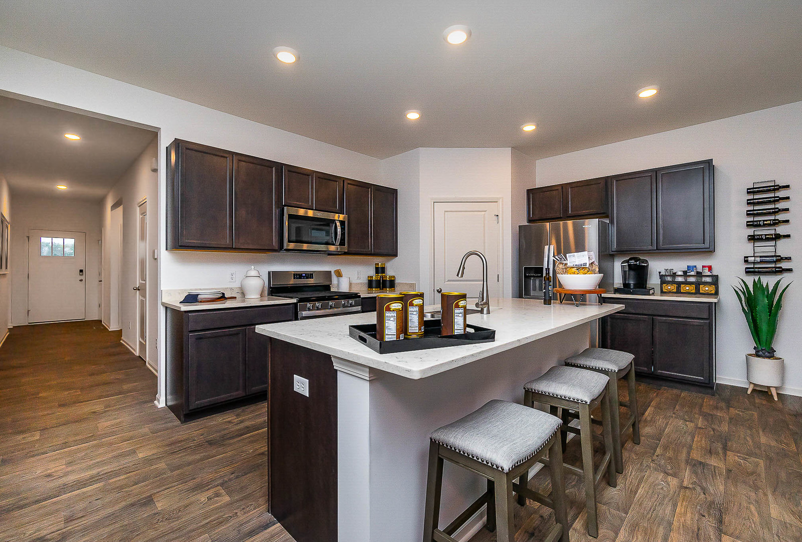 7600 West 105th Place Crown Point, IN 46307 - Photo 12 of 34 a kitchen with a sink a counter top space stainless steel appliances and cabinets