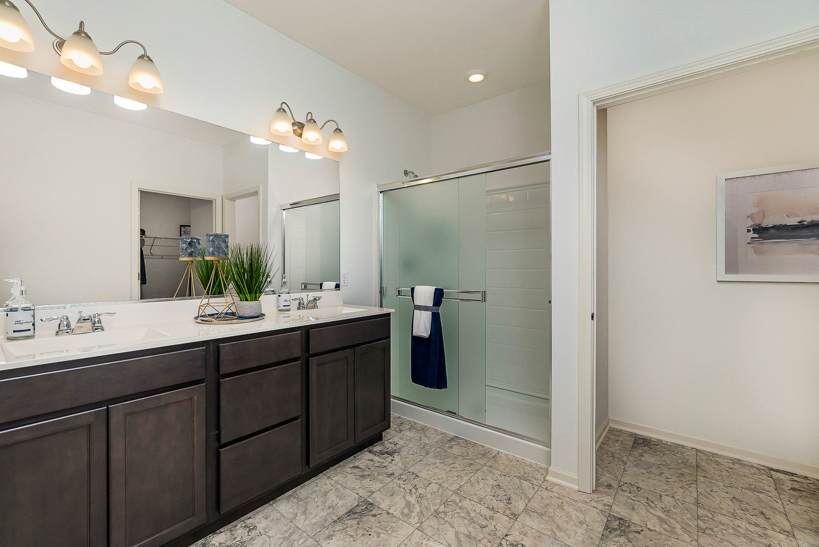 7600 West 105th Place Crown Point, IN 46307 - Photo 23 of 34 a bathroom with a double vanity sink mirror and shower