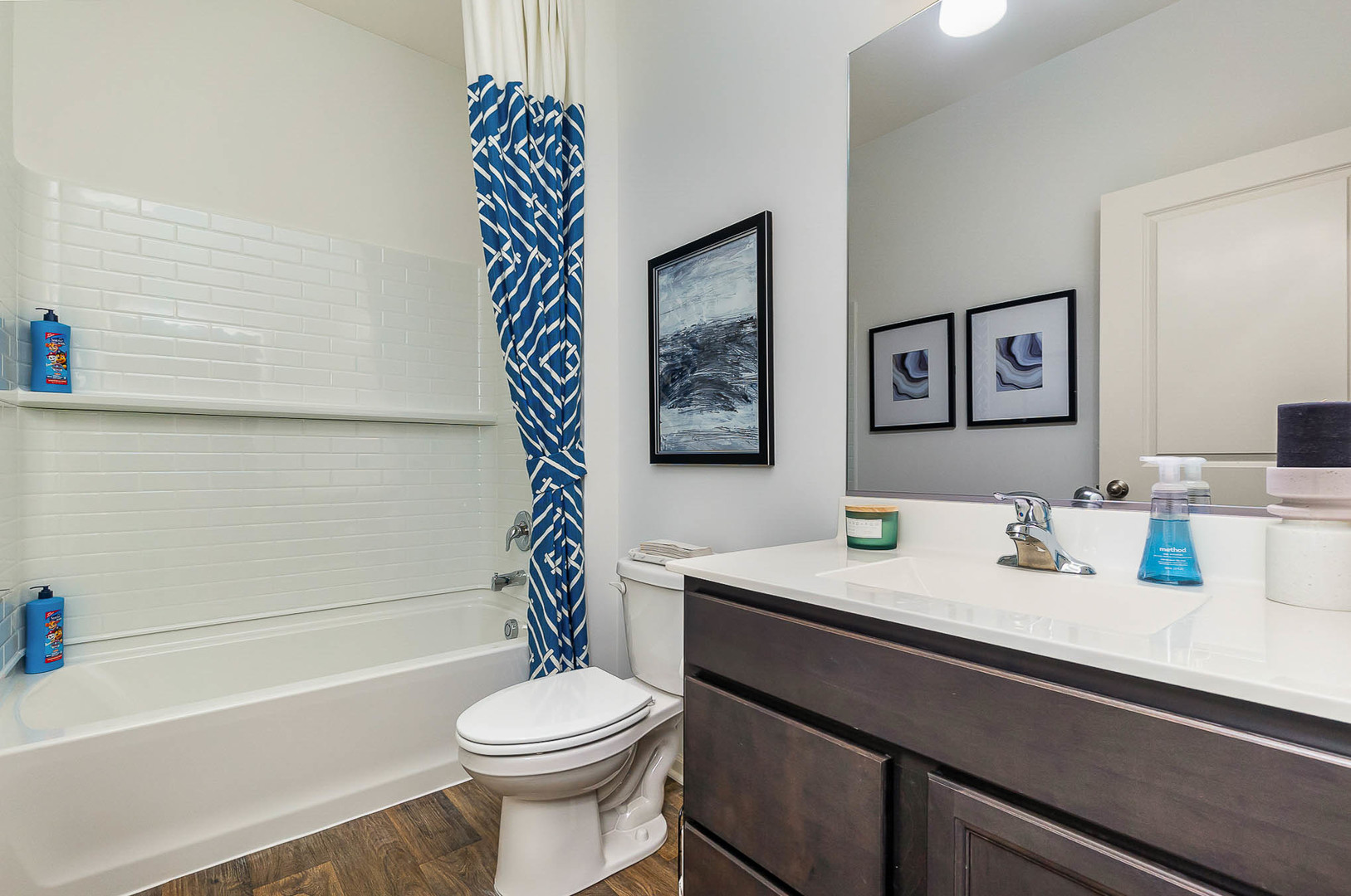 7600 West 105th Place Crown Point, IN 46307 - Photo 6 of 34 a bathroom with a sink a toilet and a bathtub
