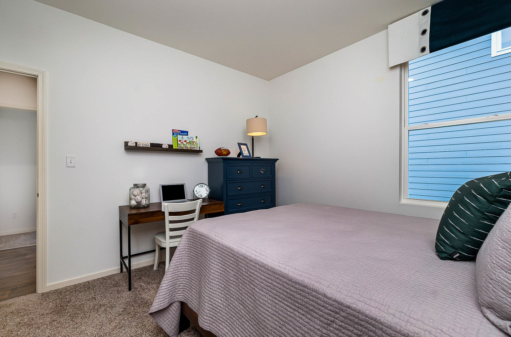 7600 West 105th Place Crown Point, IN 46307 - Photo 7 of 34 a bedroom with a bed and a desk