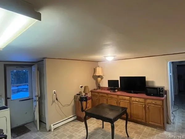 a view of a workspace with furniture