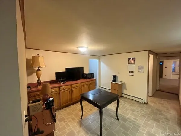 a view of a workspace with furniture