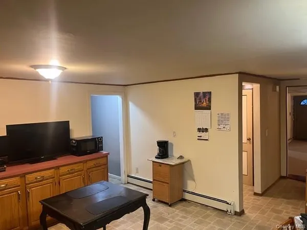 a kitchen with stainless steel appliances kitchen island granite countertop a refrigerator and a stove top oven