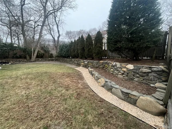 a view of a backyard of the house