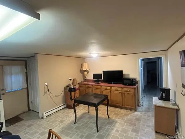 a view of a workspace with furniture