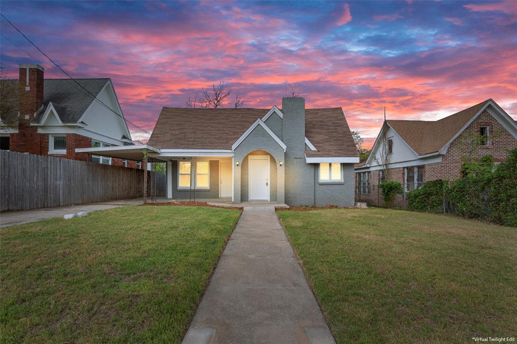 a front view of a house with yard
