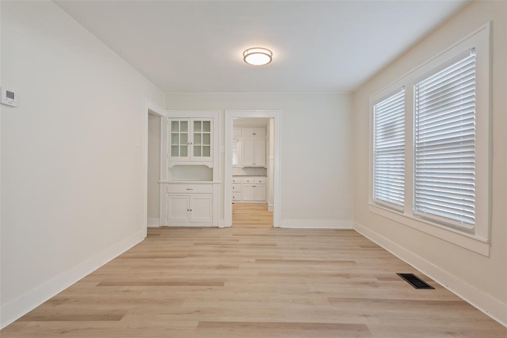 1624 North 17th Street Waco, TX 76707 - Photo 11 of 34 a view of empty room with wooden floor and fan