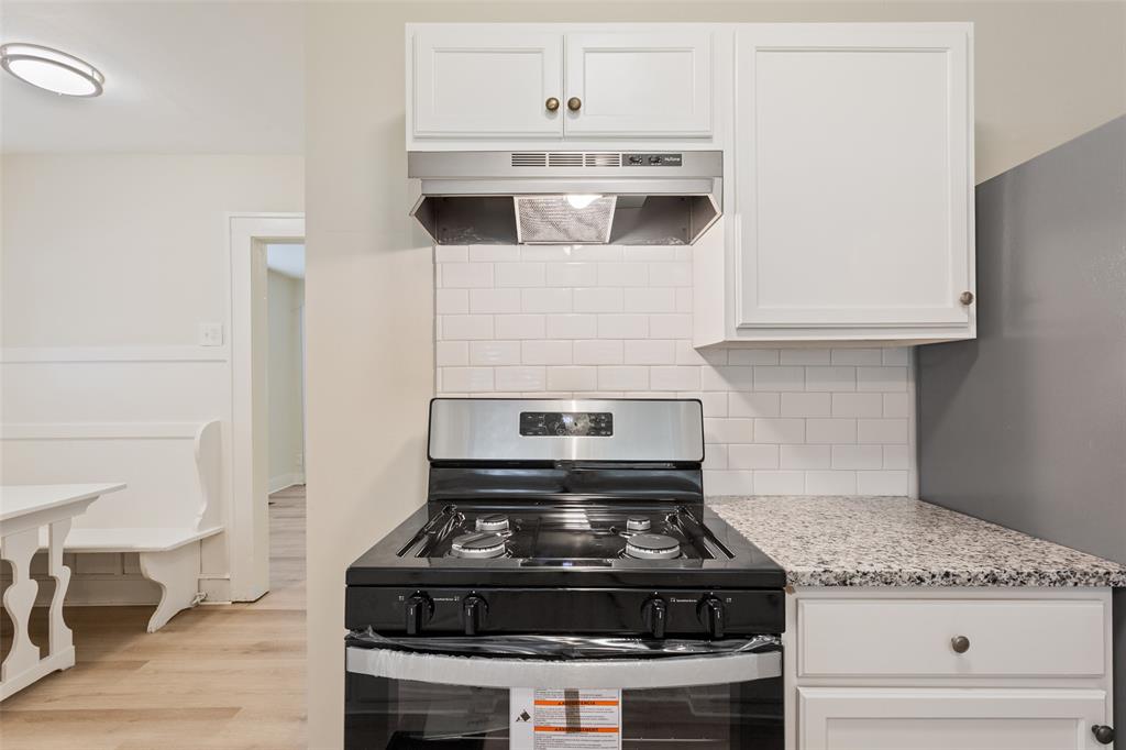 1624 North 17th Street Waco, TX 76707 - Photo 17 of 34 a stove top oven sitting inside of a kitchen