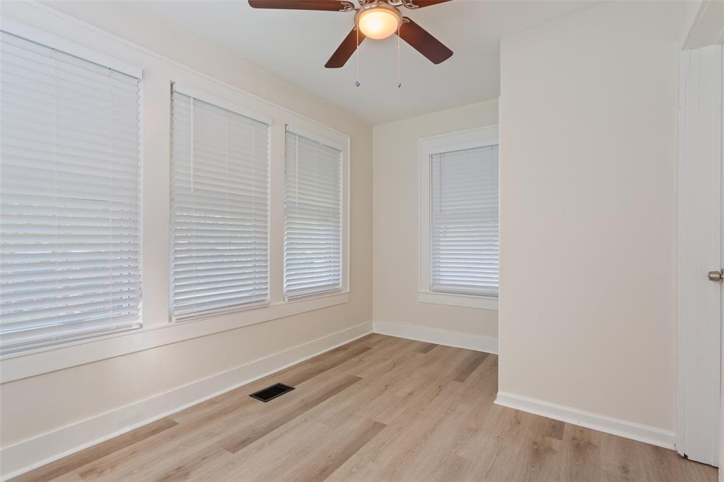 1624 North 17th Street Waco, TX 76707 - Photo 22 of 34 a view of an empty room with wooden floor and a window