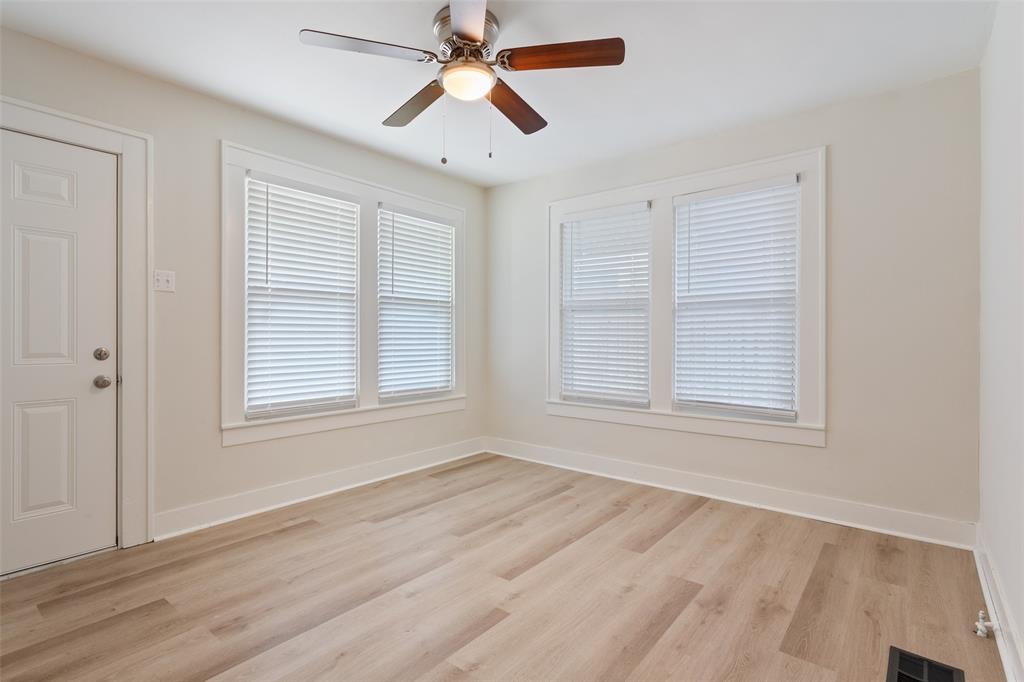 1624 North 17th Street Waco, TX 76707 - Photo 23 of 34 a view of an empty room with wooden floor and a window