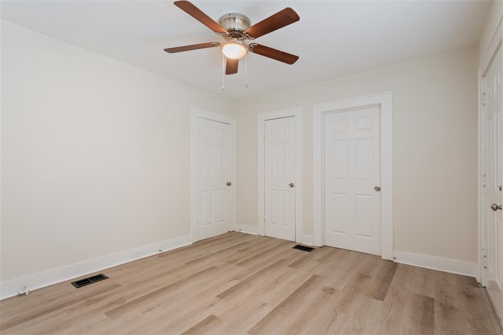 1624 North 17th Street Waco, TX 76707 - Photo 24 of 34 an empty room with wooden floor and a ceiling fan