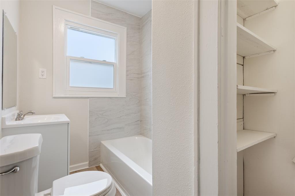 1624 North 17th Street Waco, TX 76707 - Photo 25 of 34 a bathroom with a sink toilet and shower