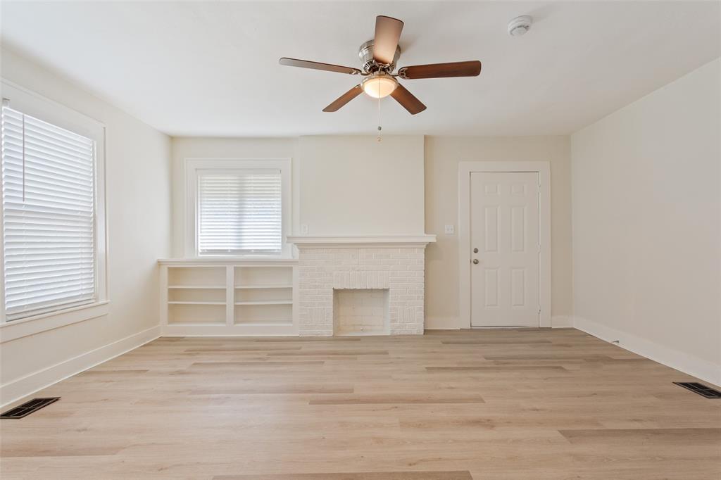 1624 North 17th Street Waco, TX 76707 - Photo 6 of 34 a view of an empty room with wooden floor and a window