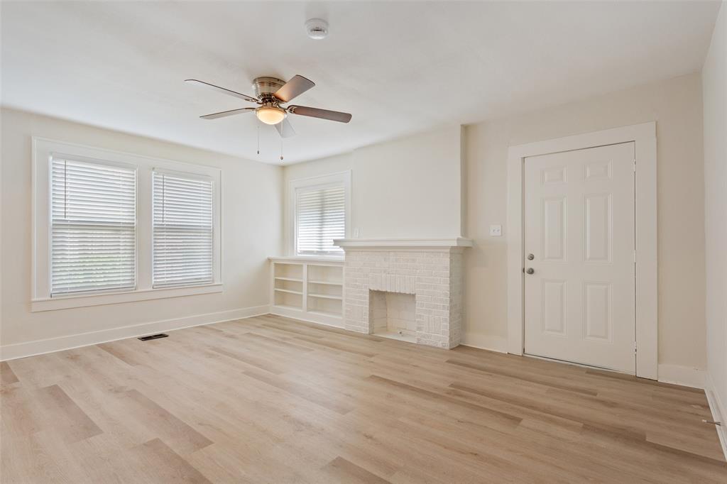 1624 North 17th Street Waco, TX 76707 - Photo 7 of 34 a view of an empty room with a window and a kitchen