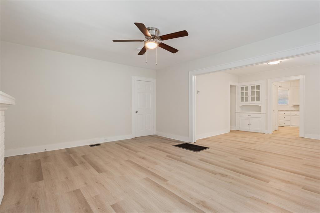 1624 North 17th Street Waco, TX 76707 - Photo 8 of 34 a view of empty room with wooden floor and ceiling fan