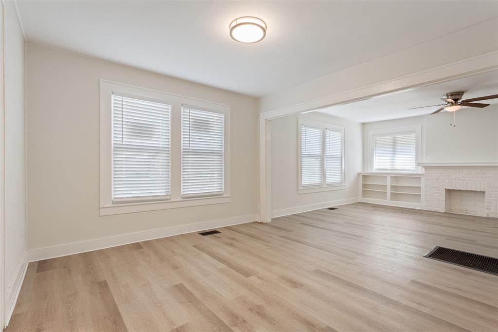1624 North 17th Street Waco, TX 76707 - Photo 10 of 34 an empty room with wooden floor and windows