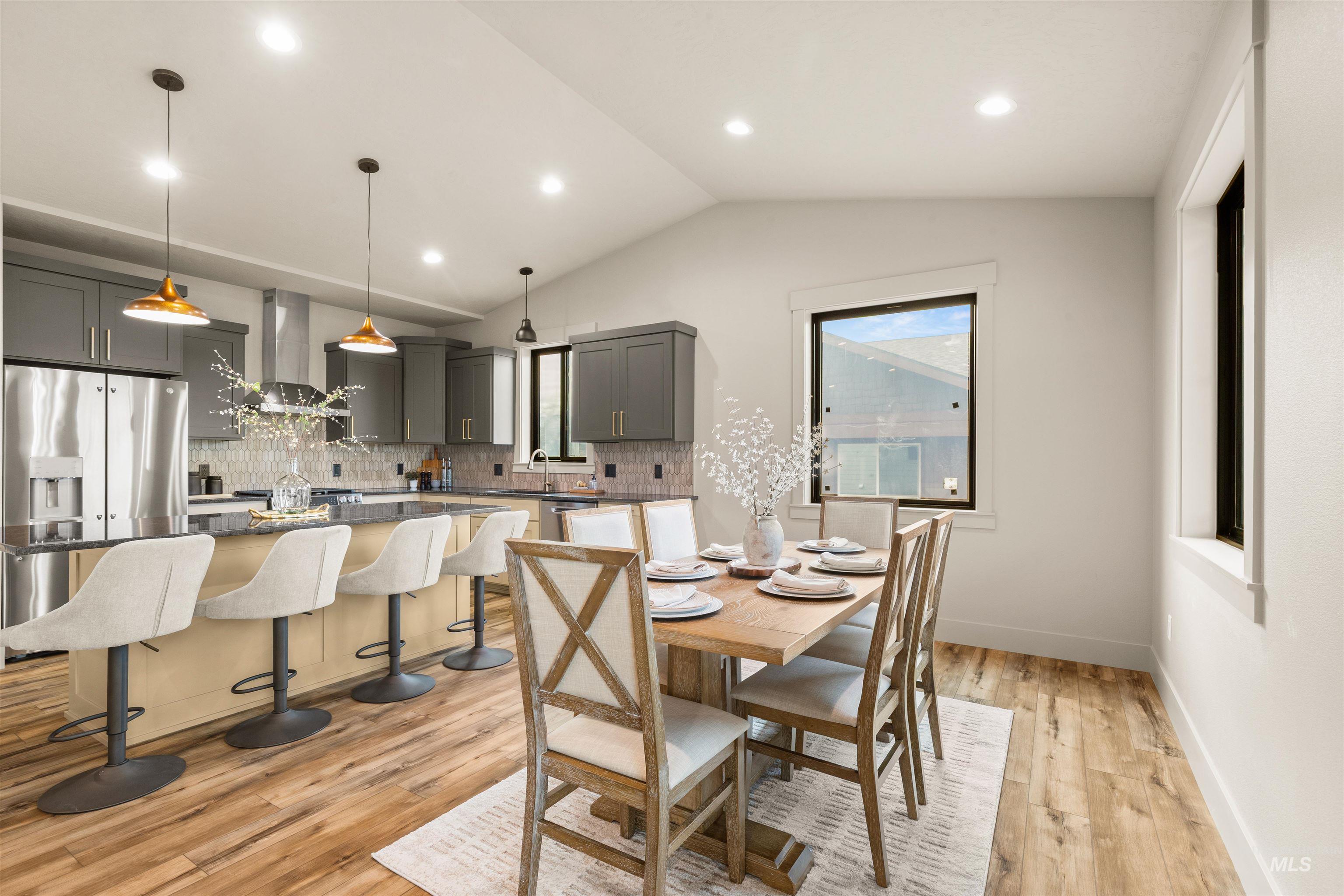 335 Warner Avenue Lewiston, ID 83501 - Photo 20 of 43 Dining area with light wood-style floors, recessed lighting, and vaulted ceiling