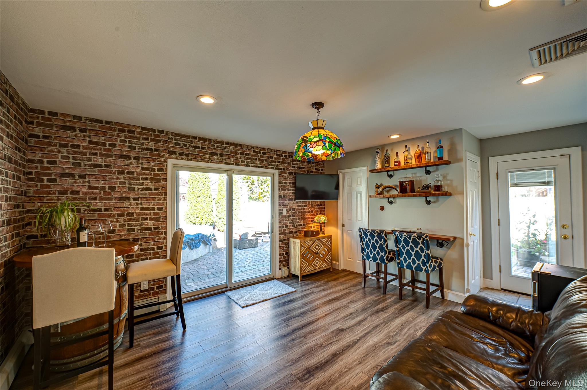 1 Freedom Court Babylon, NY 11702 - Photo 11 of 23 a view of a dining room with furniture window and wooden floor