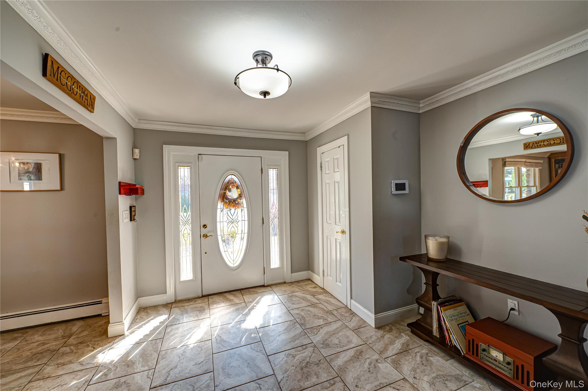 1 Freedom Court Babylon, NY 11702 - Photo 2 of 23 a view of a livingroom with front door