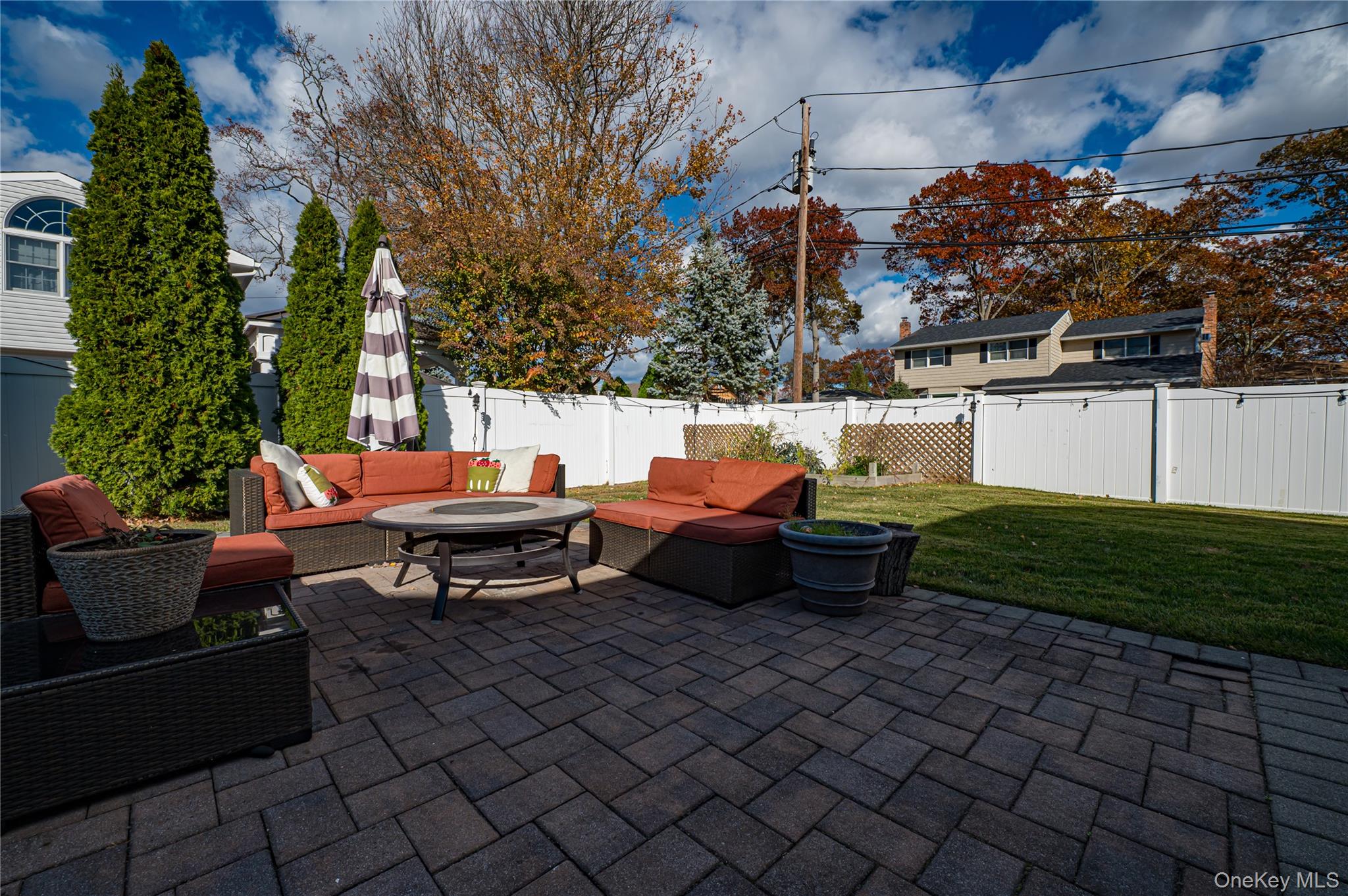1 Freedom Court Babylon, NY 11702 - Photo 21 of 23 a backyard of a house with barbeque oven table and chairs